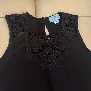 CeCe size small black tank with flower detail on neckline. EUC.